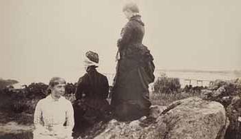 Mrs. Ellerton Pratt, Mrs. George D. Howe, and Alice Pratt on rocks at Smith`s Point Photograph